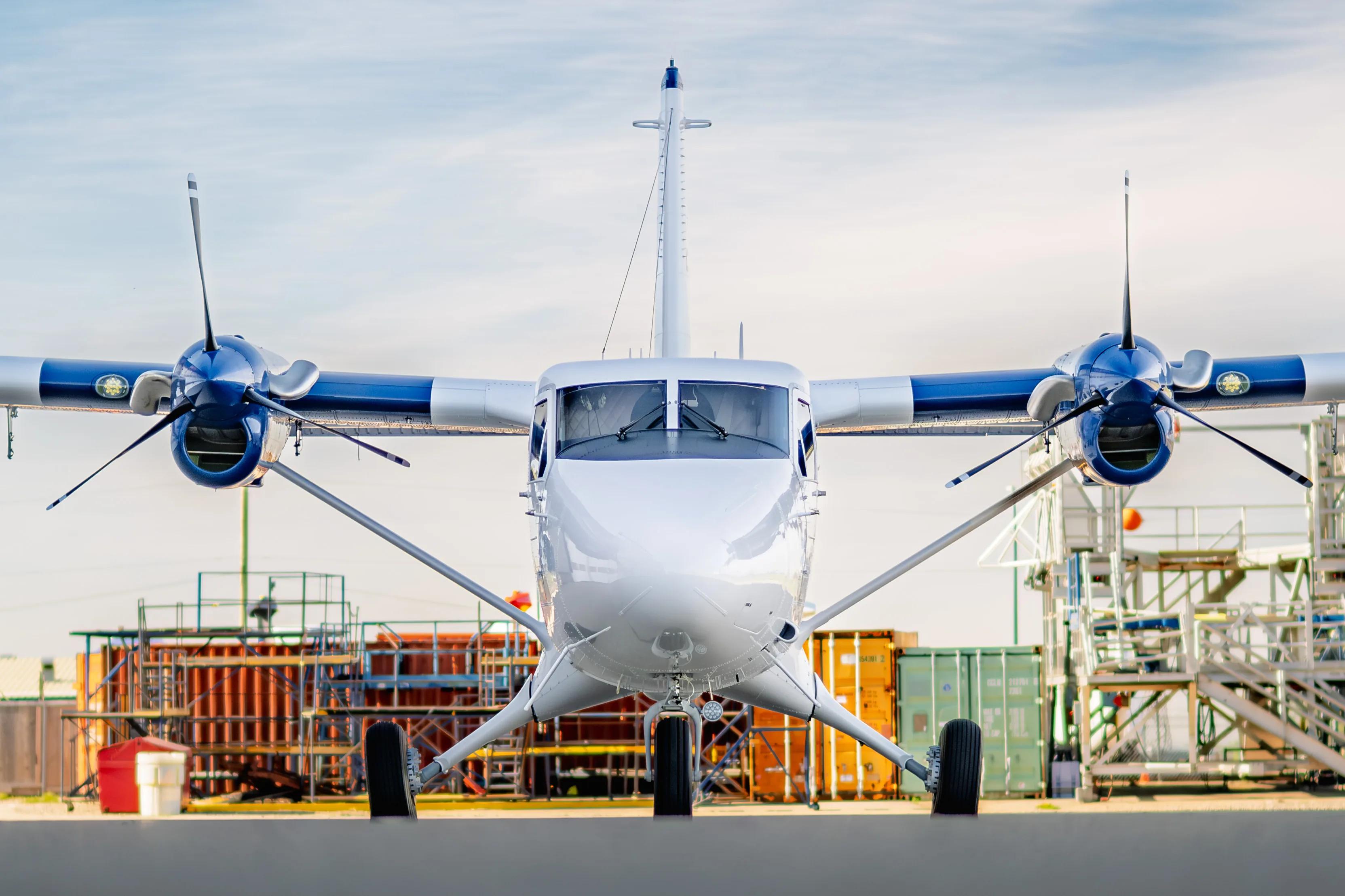 A new Zimex Twin Otter Classic 300-G seen head-on on the apron, blue engine nacelles and propellers