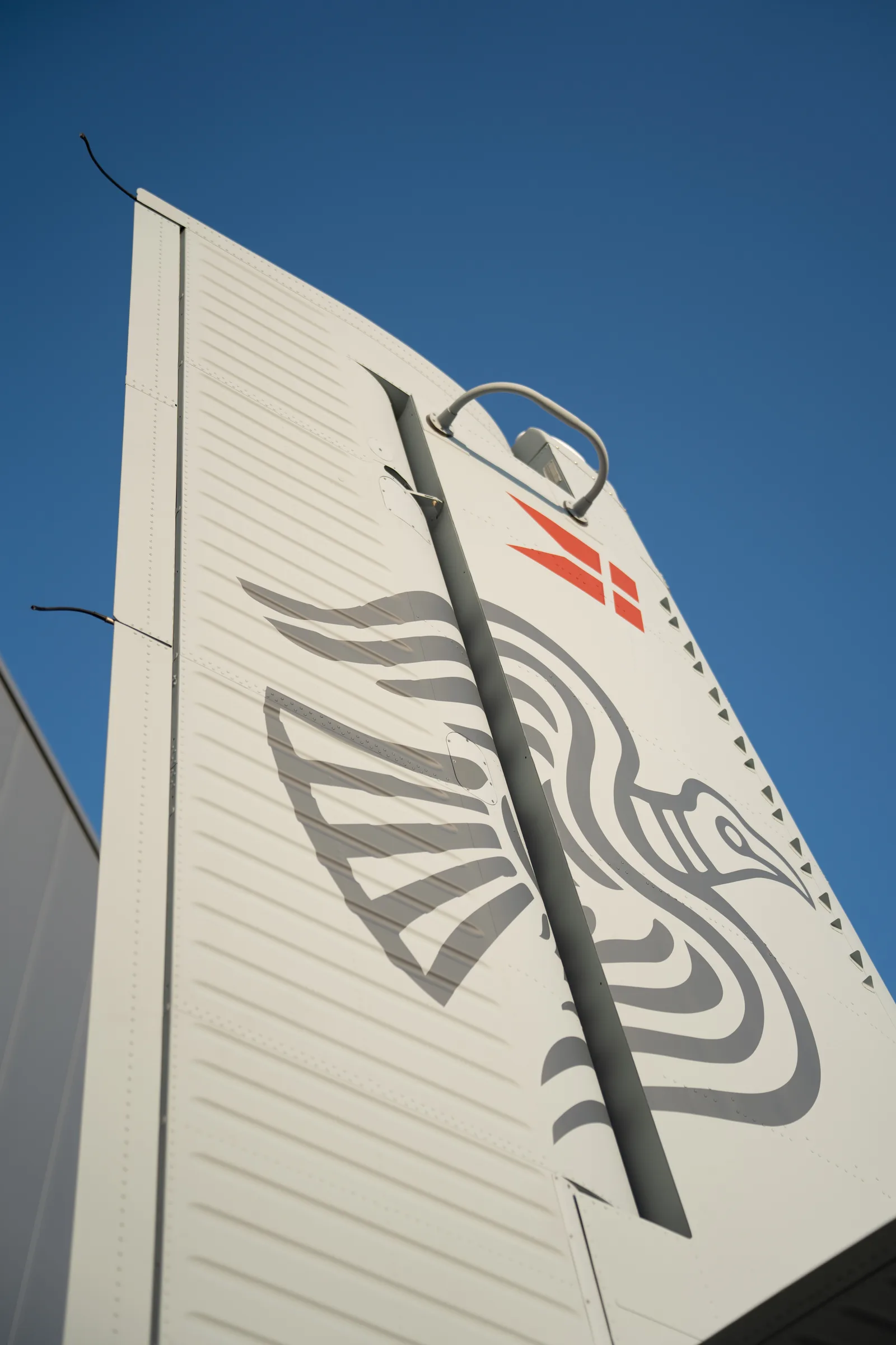 Tail of a Danish Home Guard Twin Otter with a stylised raven