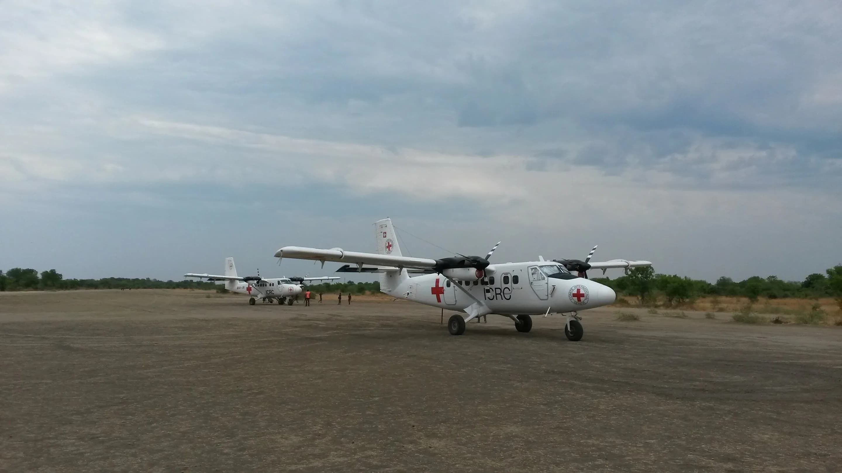 ICRC Twin Otter on a gravel apron at Kajjansi, Uganda