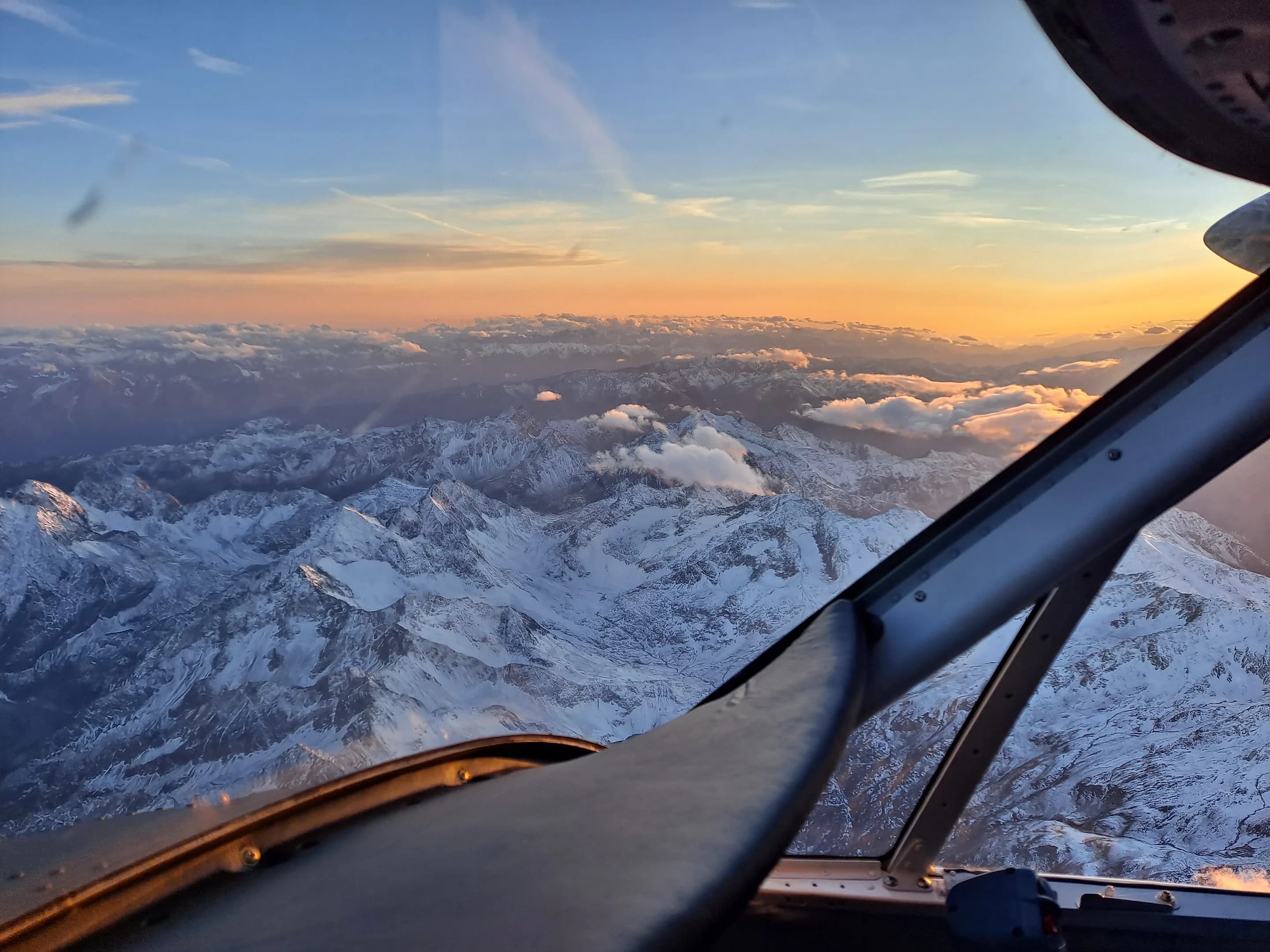 The Alps at sunrise from a Twin Otter cockpit