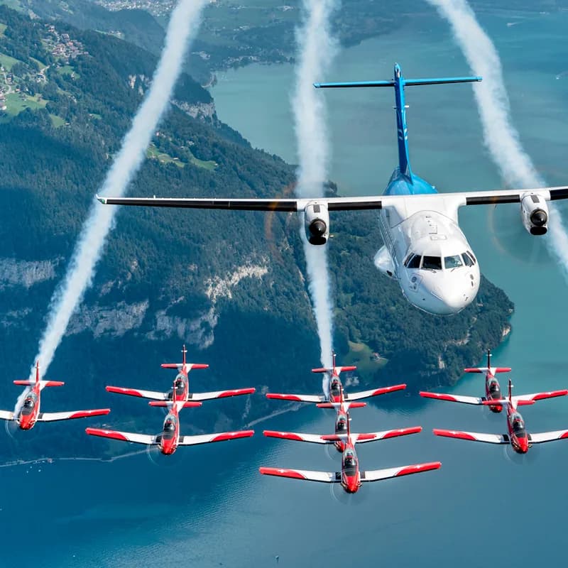 Zimex ATR 42 HB-ALN flying in formation with the Swiss Air Force PC-7 Team.