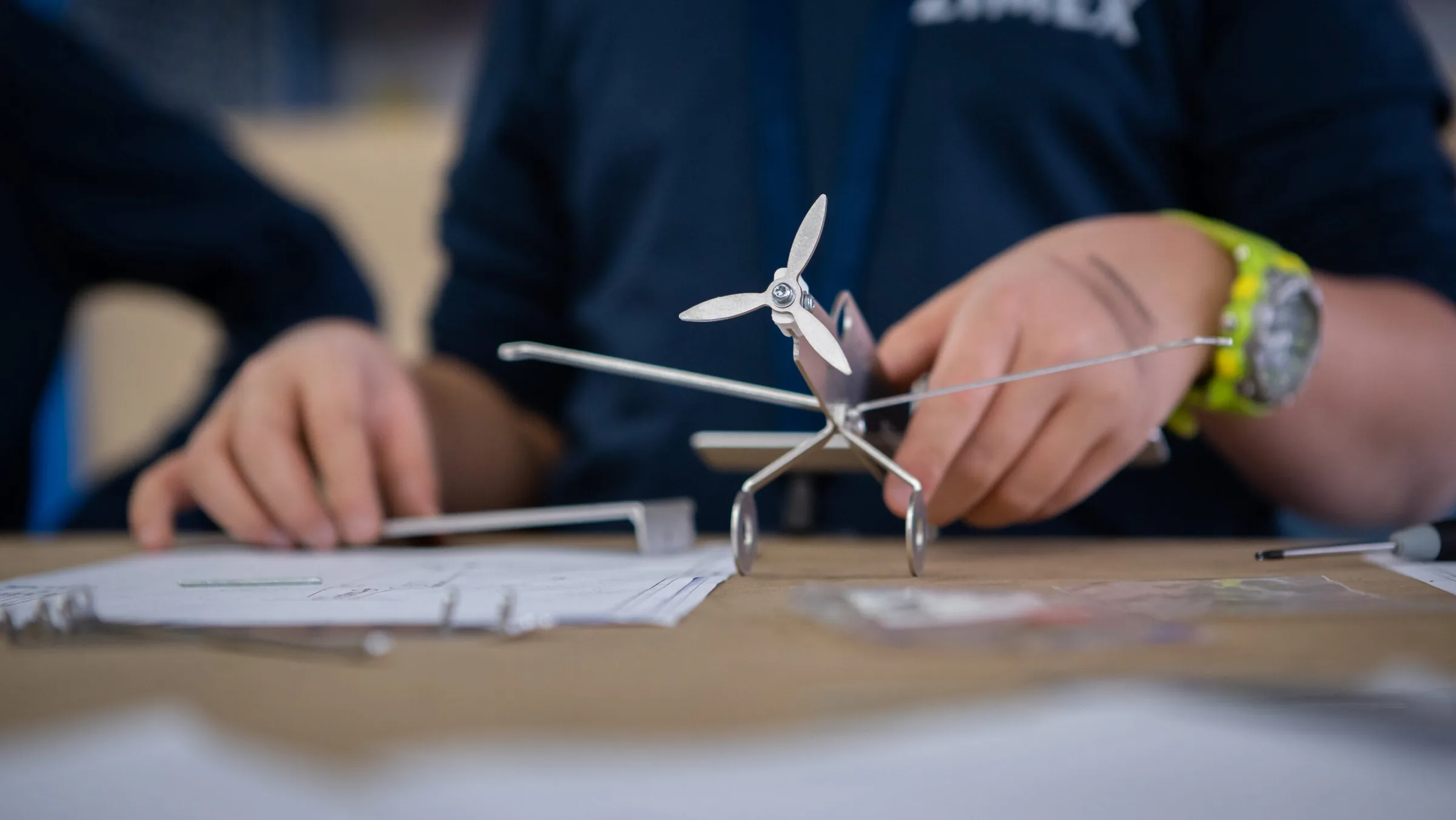 A child assembling a model aircraft at the Zimex open day.