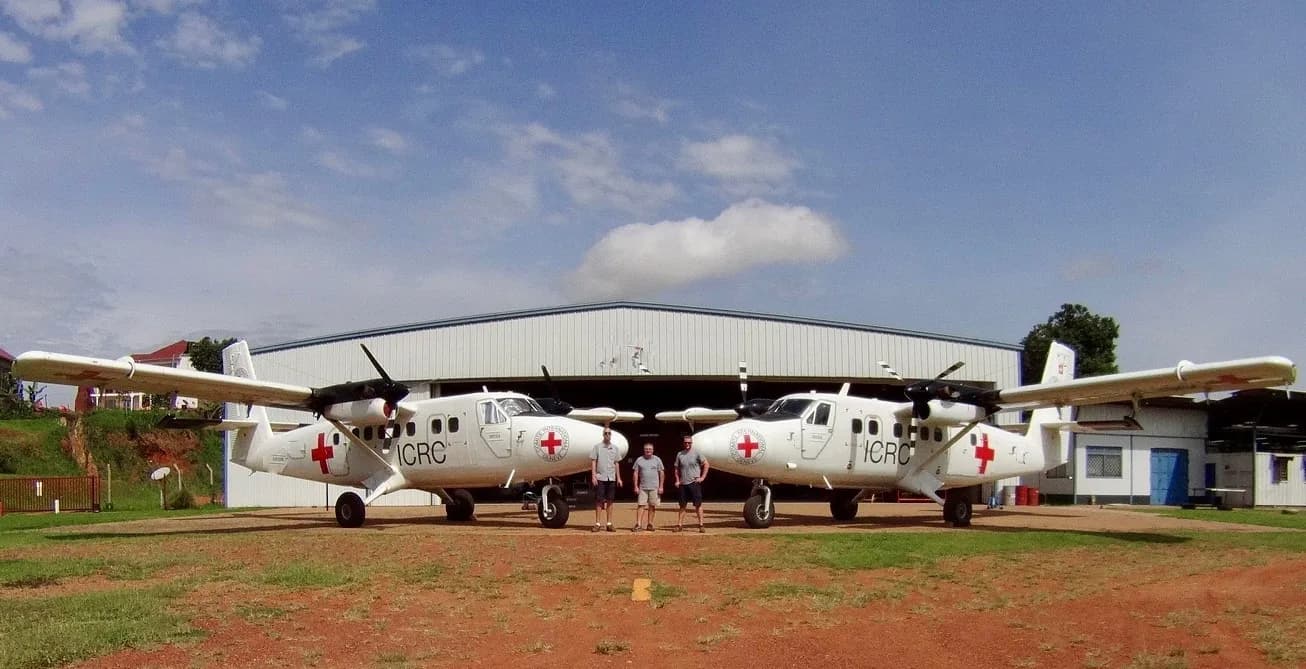 Two ICRC Twin Otters in front of the hangar at Kajjansi, Uganda