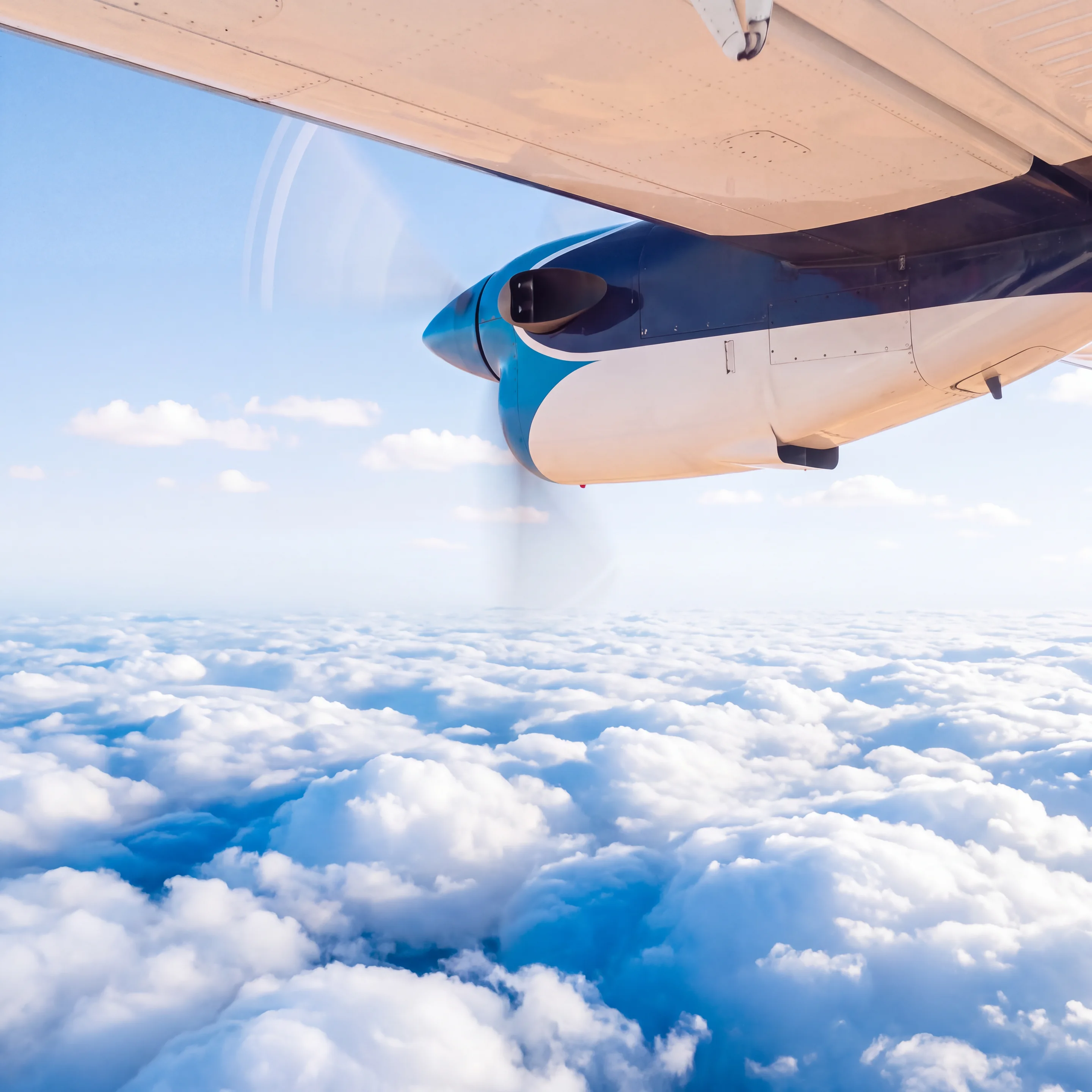 A sea of white cloud below the wing of a Zimex Twin Otter